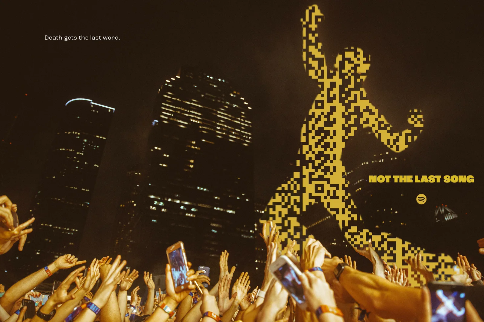 Night skyline over a crowd, a giant gold code figure against the towers. Headline, Death gets the last word. Not the last song.