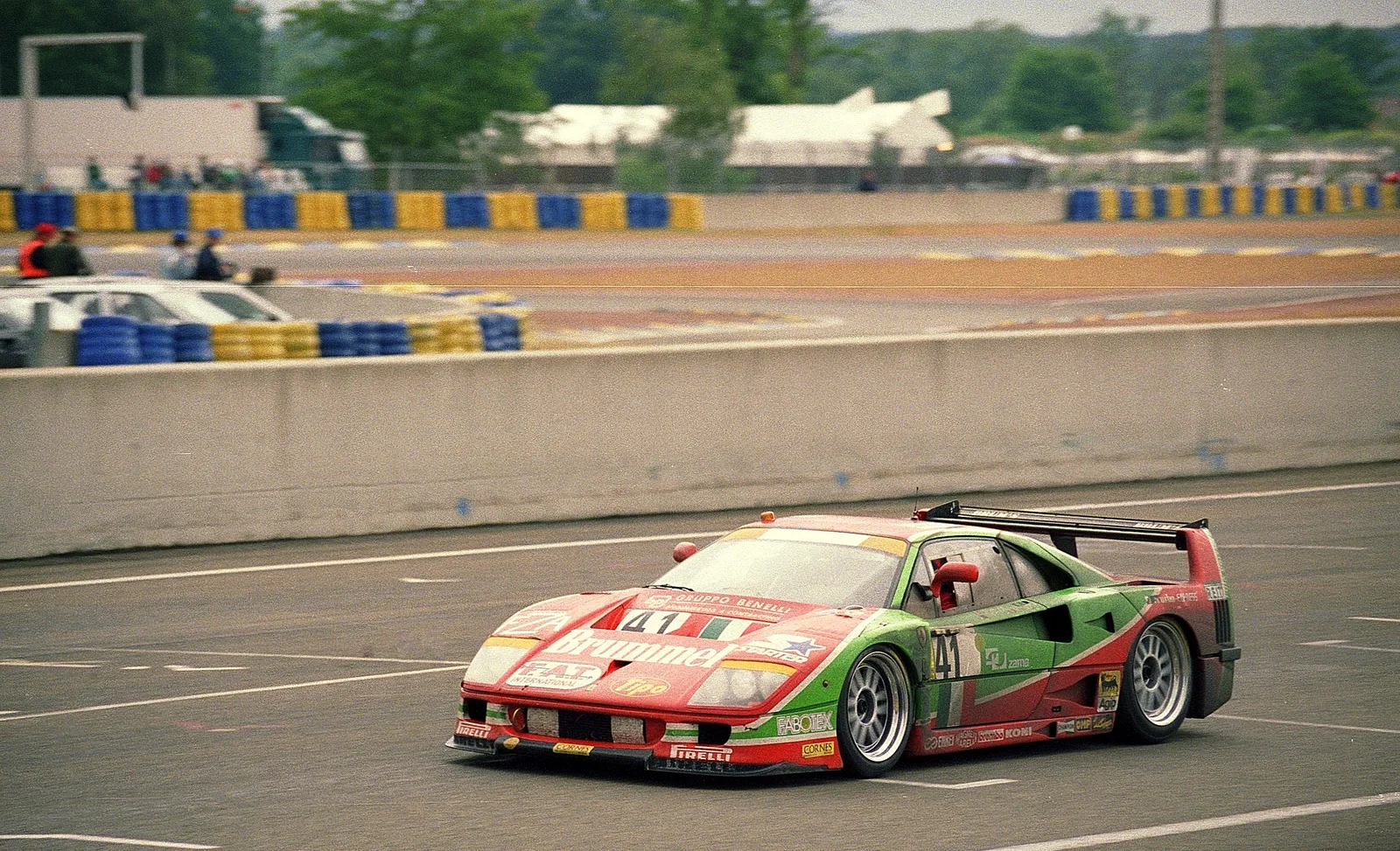 Photograph of the Ferrari F40 GTE number 41 on the pit straight at Le Mans, 1995