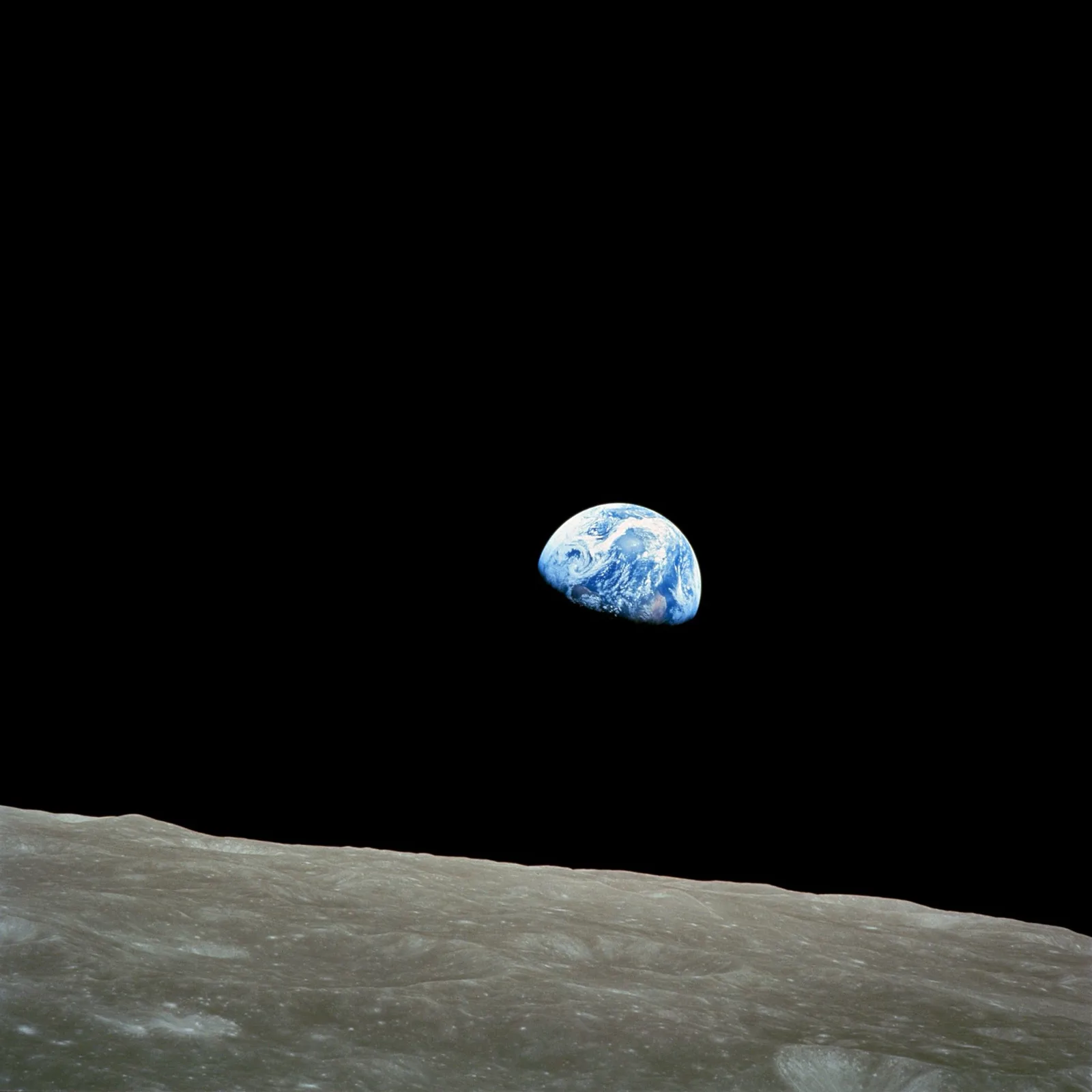 Earthrise over the lunar horizon, Apollo 8